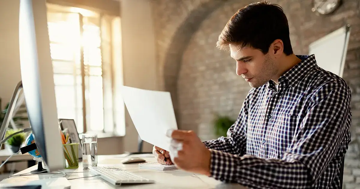 Small business owner reviewing a 13-week cash flow forecast