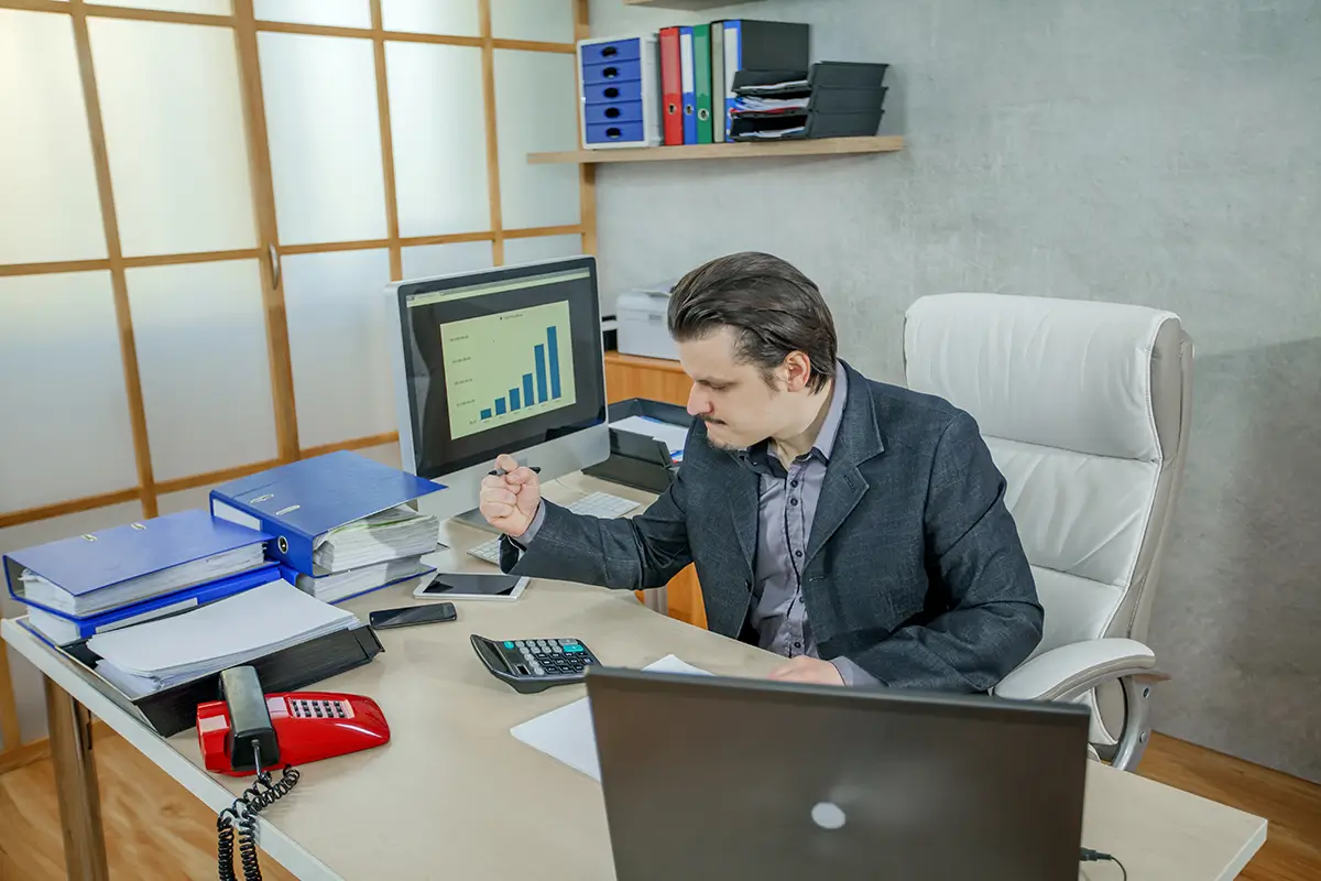 Small business owner calculating Etsy product profit margin