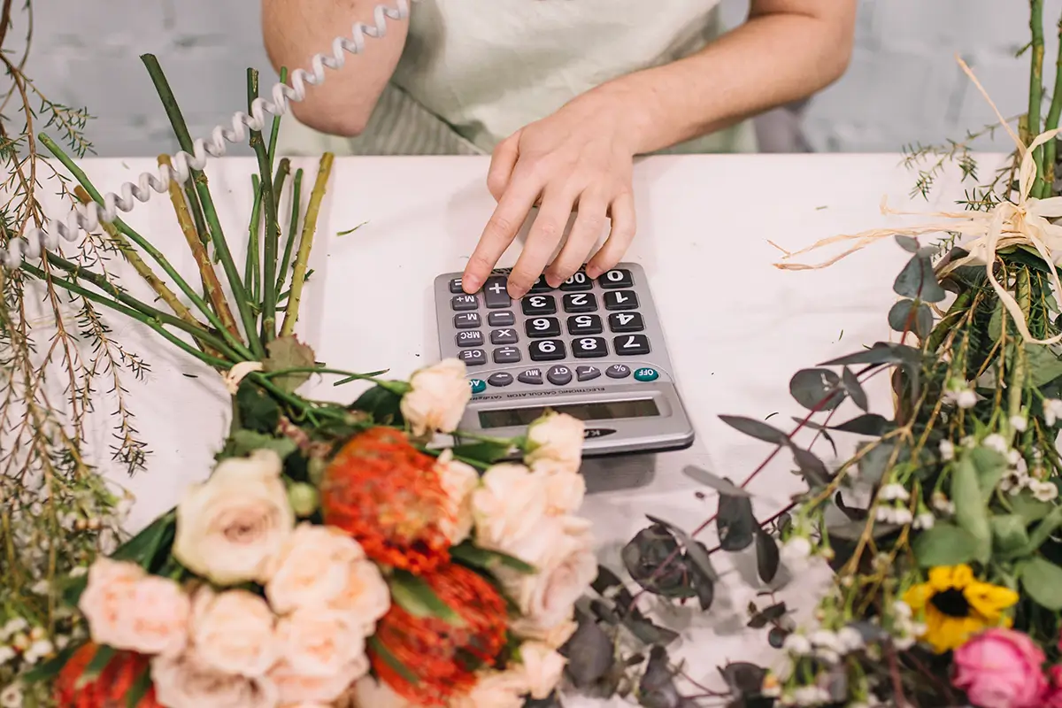 Etsy Pricing Formula: How to Price Products for Profit 4 Handmade seller calculating an Etsy product selling price