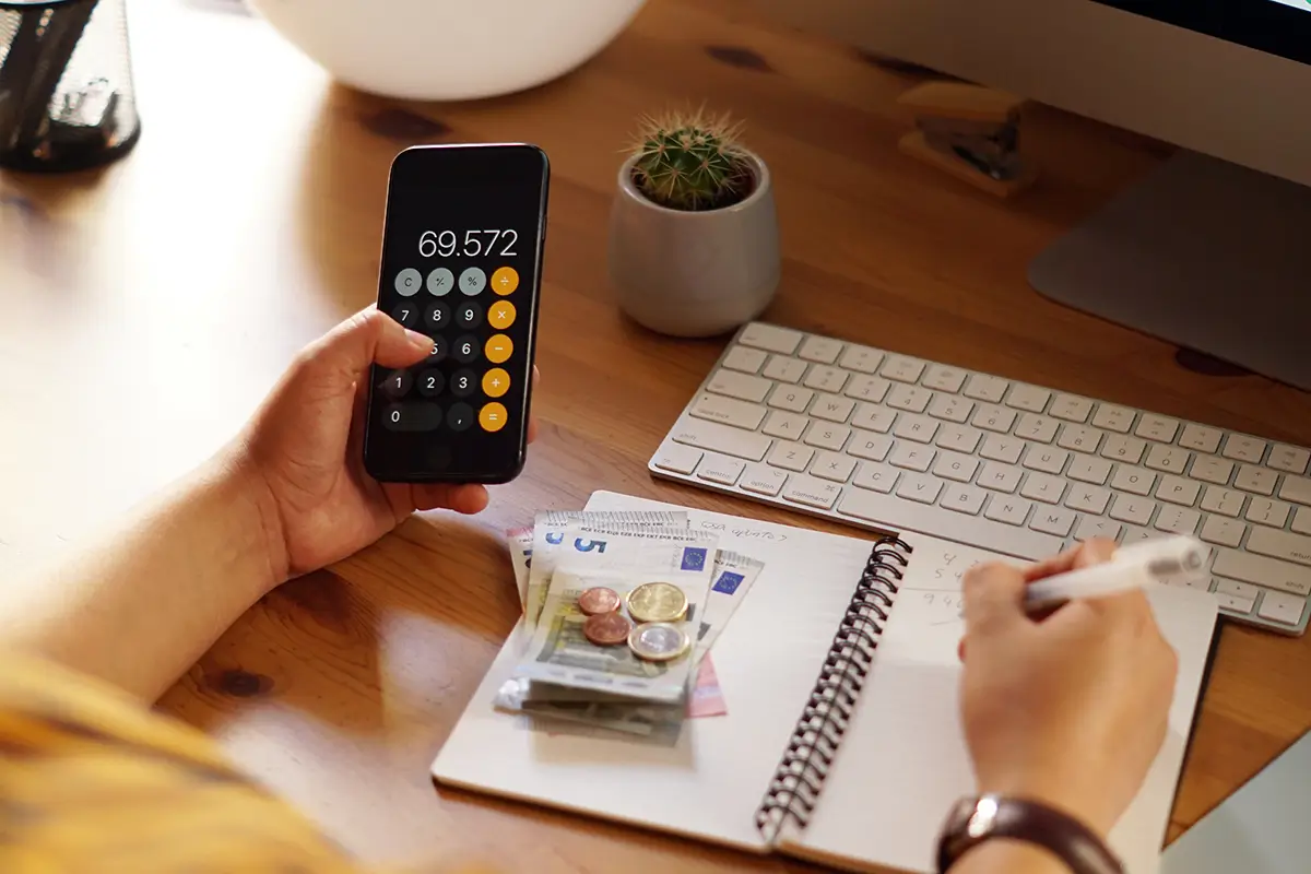 Etsy Pricing Formula: How to Price Products for Profit 2 Small business owner calculating the true cost of an Etsy product