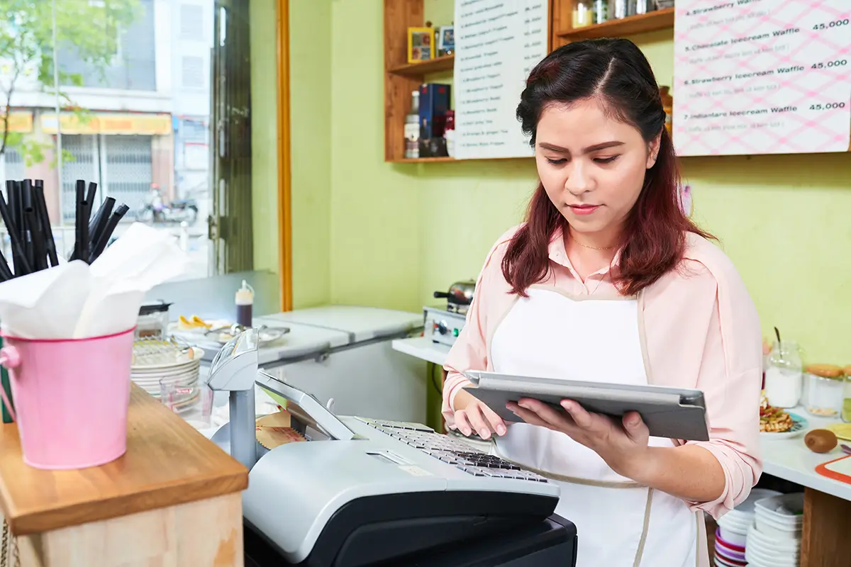 Handmade business owner reviewing Etsy product expenses