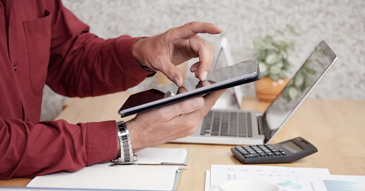 Small business owner calculating Etsy seller fees