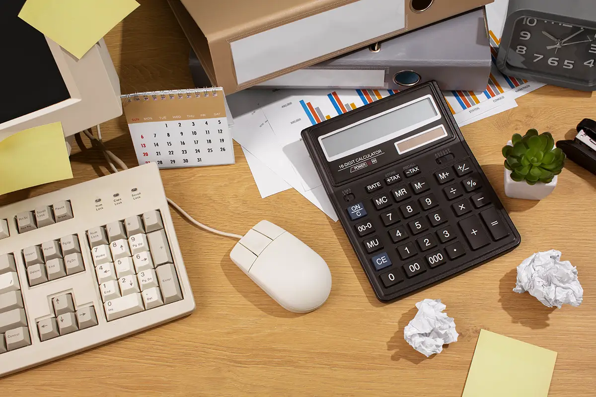 Calculator and receipts used to calculate Etsy selling costs