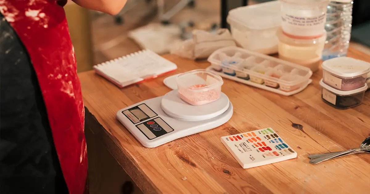 Handmade business owner calculating product prices
